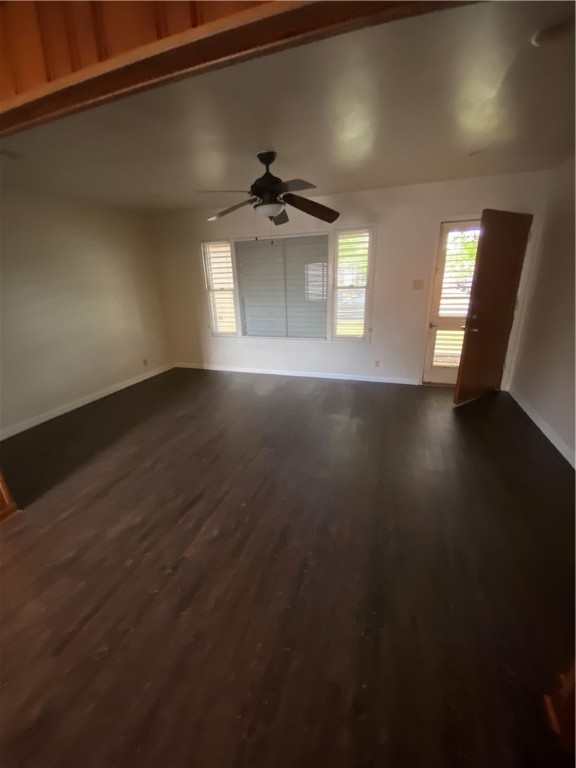 925 Stirman Street Corpus Christi, TX 78411 - Photo 7 of 16 an empty room with wooden floor and windows