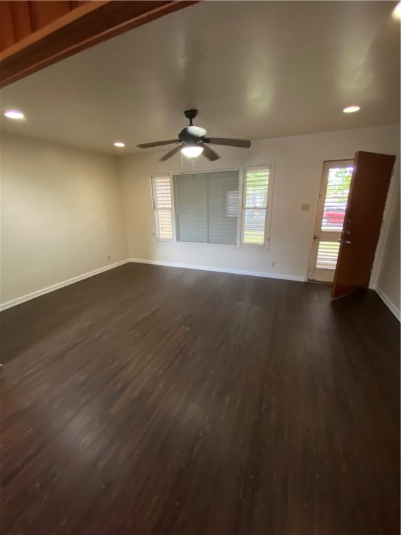 925 Stirman Street Corpus Christi, TX 78411 - Photo 8 of 16 an empty room with wooden floor chandelier fan and windows