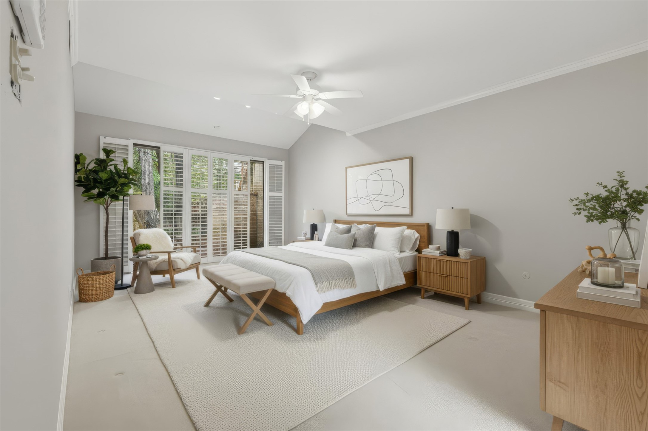 201 Vanderpool Lane, Unit 122 Houston, TX 77024 - Photo 14 of 35 a spacious bedroom with a bed and a couch