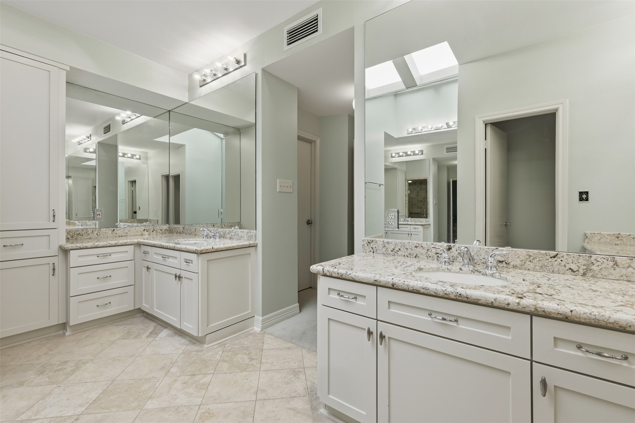 201 Vanderpool Lane, Unit 122 Houston, TX 77024 - Photo 17 of 35 a bathroom with a granite countertop sink mirror and a