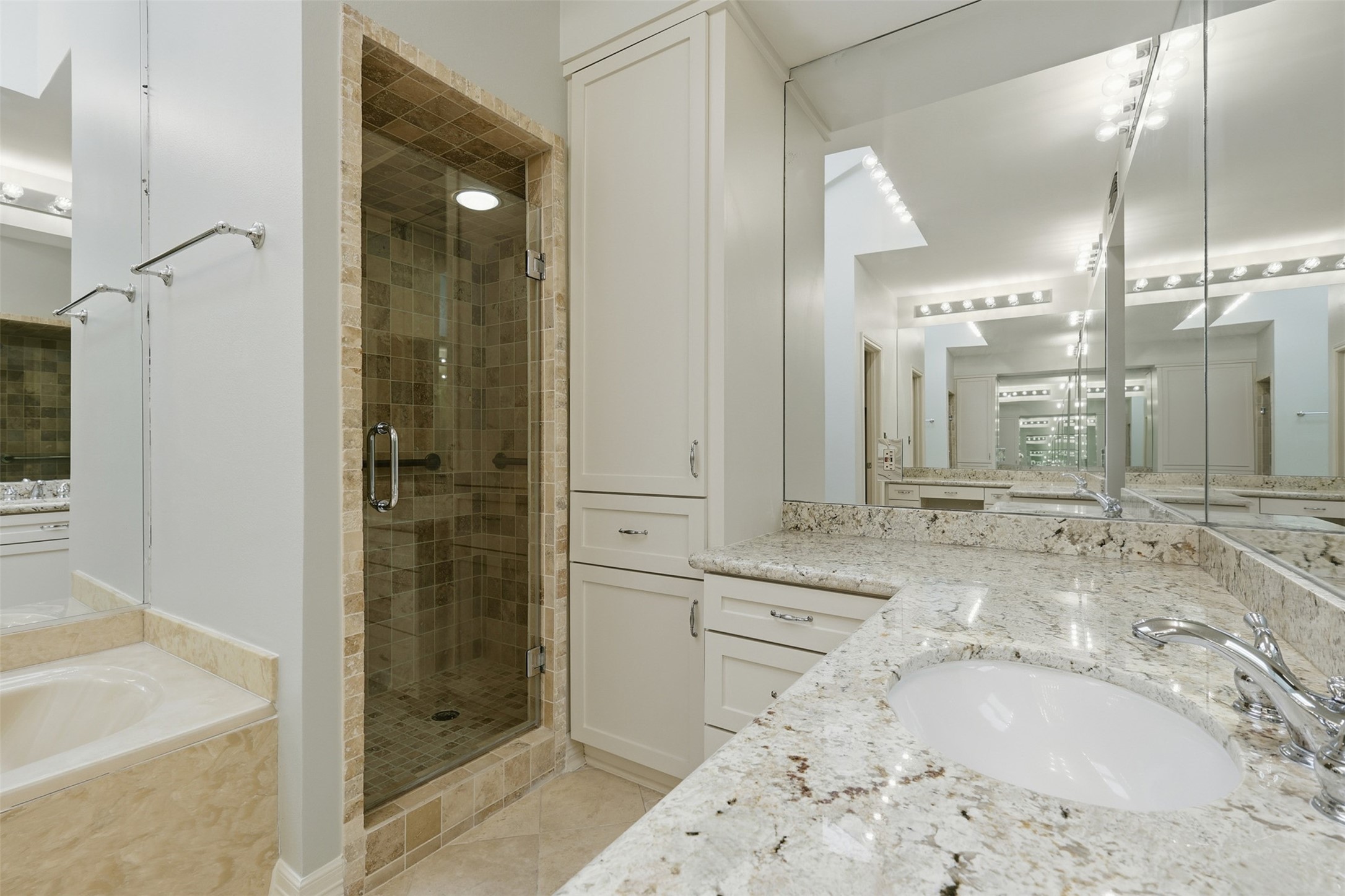201 Vanderpool Lane, Unit 122 Houston, TX 77024 - Photo 18 of 35 a bathroom with a tub sink shower and mirror