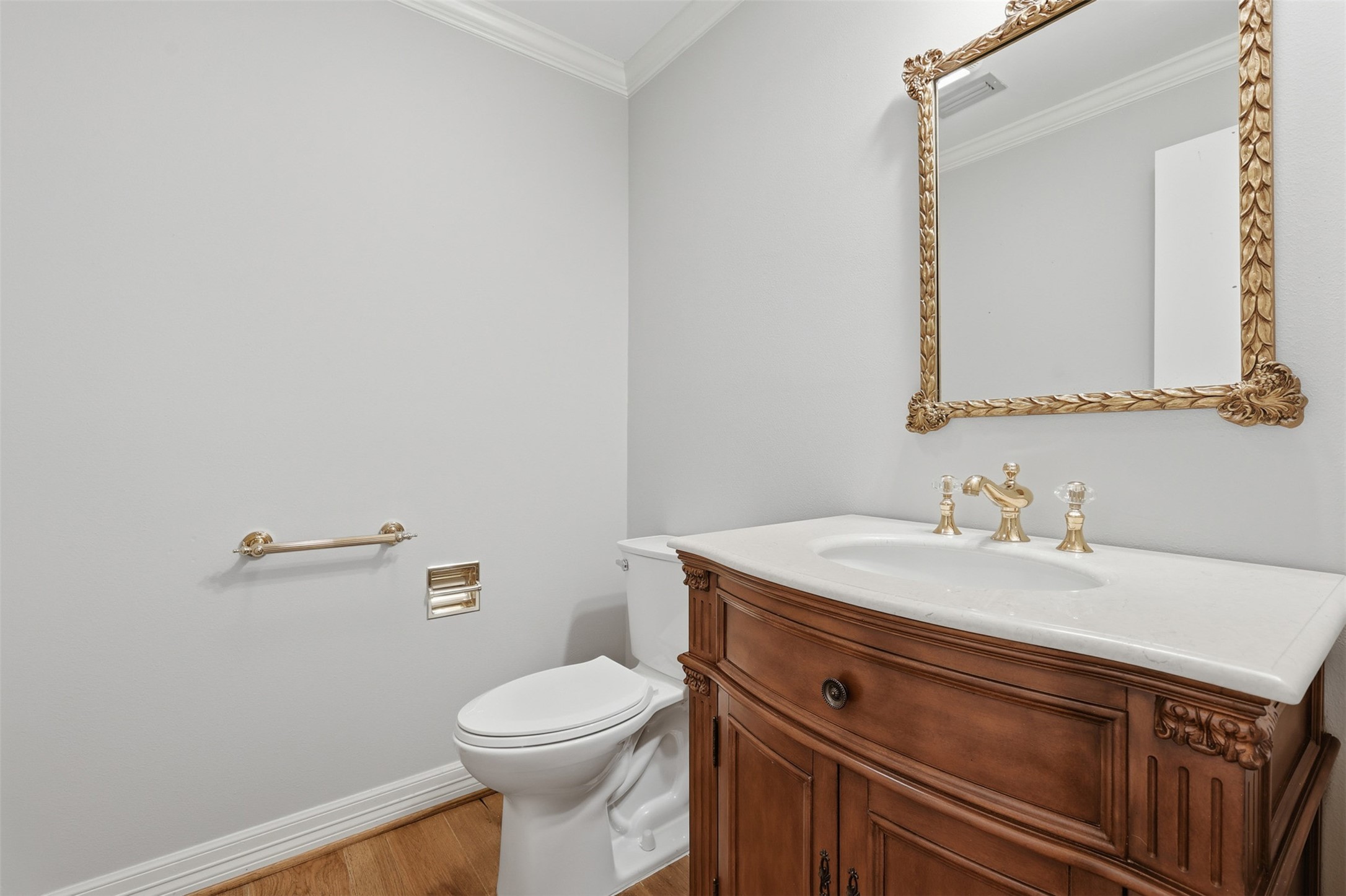 201 Vanderpool Lane, Unit 122 Houston, TX 77024 - Photo 19 of 35 a bathroom with a sink a toilet and mirror