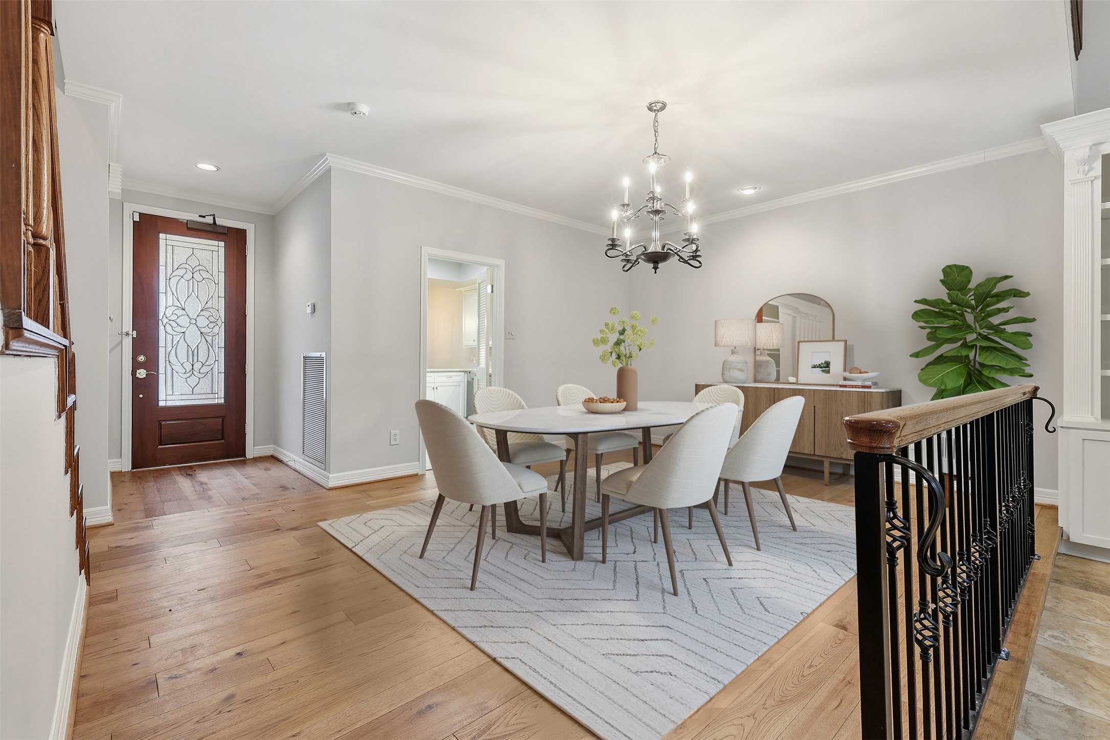 201 Vanderpool Lane, Unit 122 Houston, TX 77024 - Photo 3 of 35 a view of a dining room with furniture and wooden floor