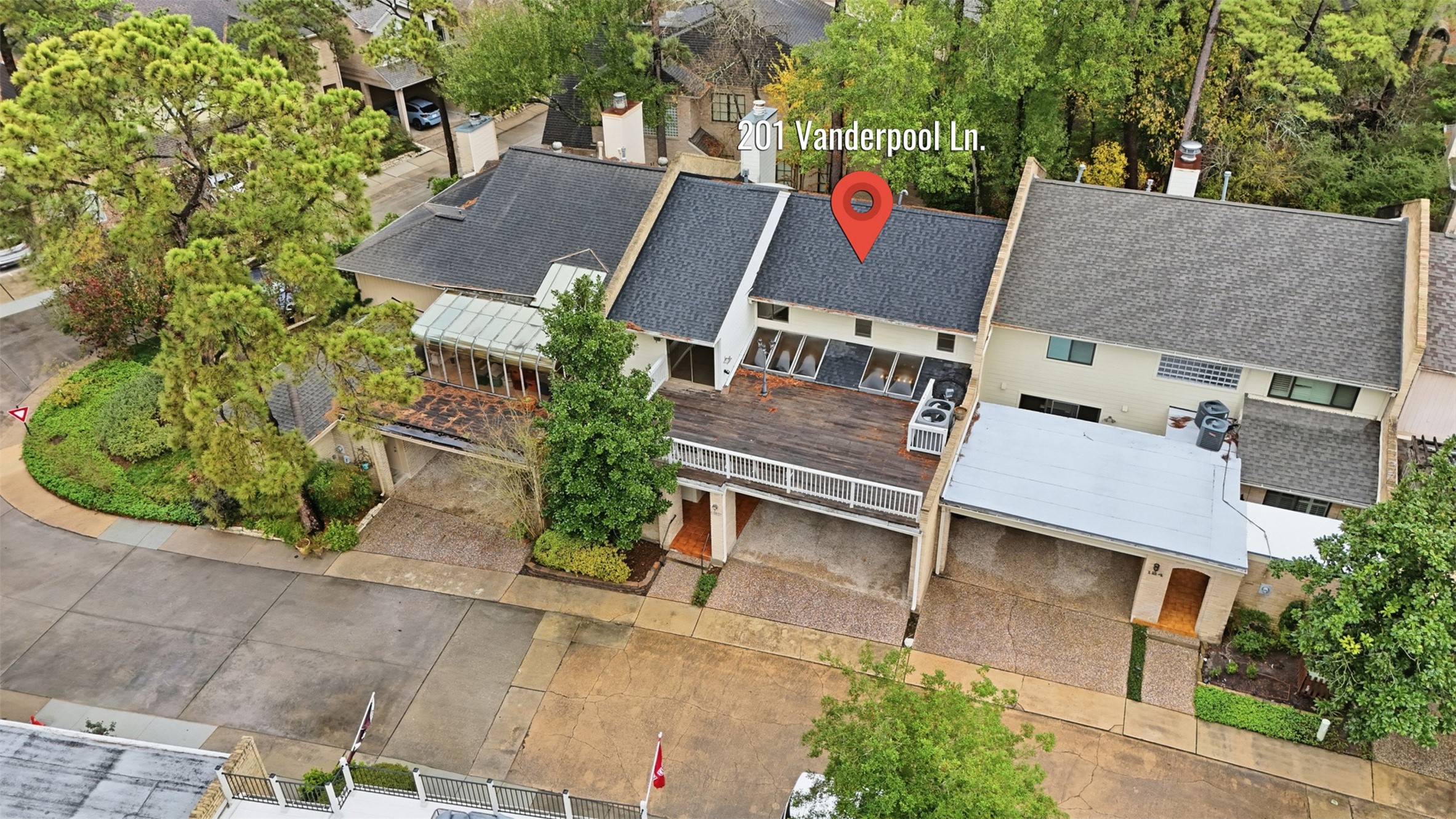 201 Vanderpool Lane, Unit 122 Houston, TX 77024 - Photo 33 of 35 an aerial view of a house with a yard and trees