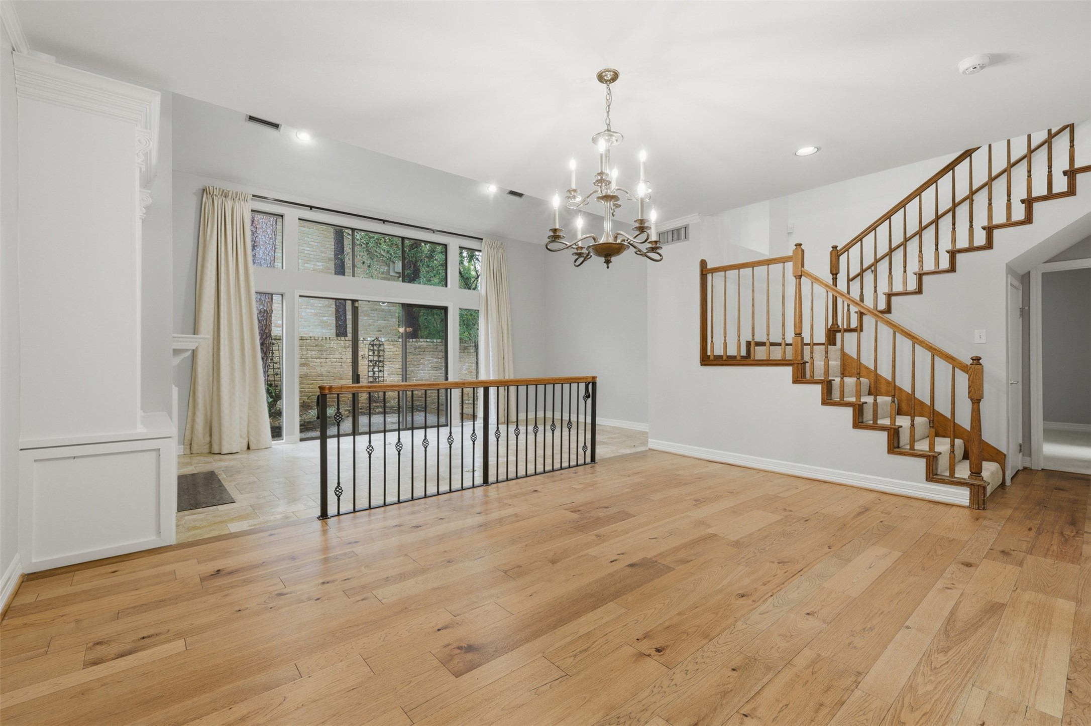 201 Vanderpool Lane, Unit 122 Houston, TX 77024 - Photo 6 of 35 a view of an empty room with wooden floor