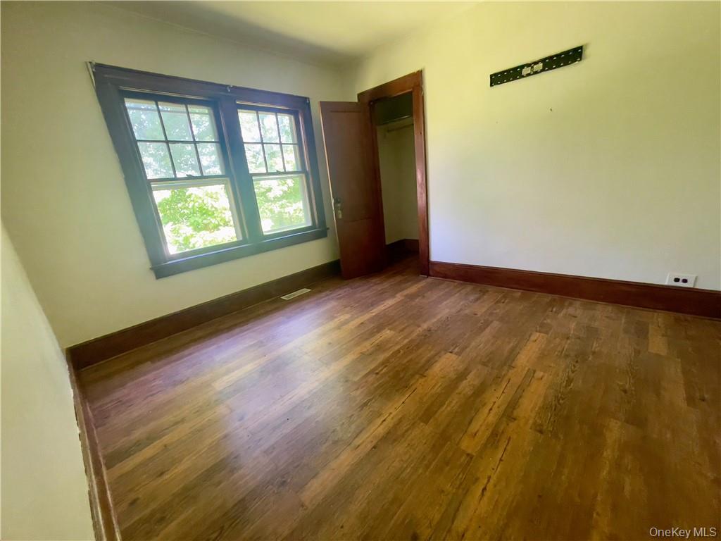 4 Old Turnpike Road Bloomingburg, NY 12721 - Photo 17 of 27 Spare room featuring dark wood-type flooring