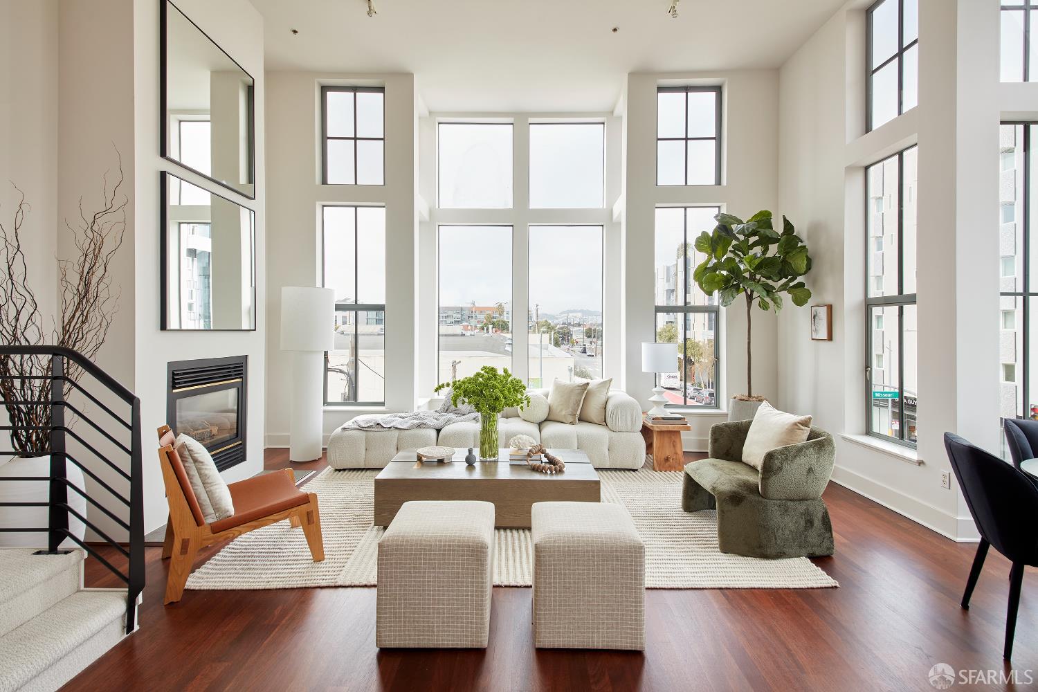 999 16th Street, Unit 11 San Francisco, CA 94107 - Photo 1 of 15 a living room with furniture and a large window