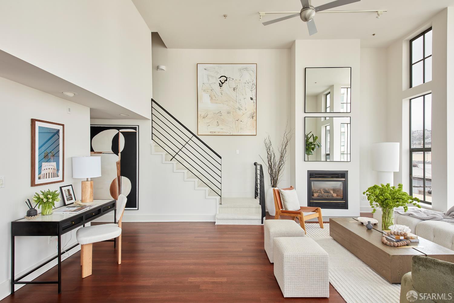 999 16th Street, Unit 11 San Francisco, CA 94107 - Photo 2 of 15 a living room with fireplace furniture and a wooden floor