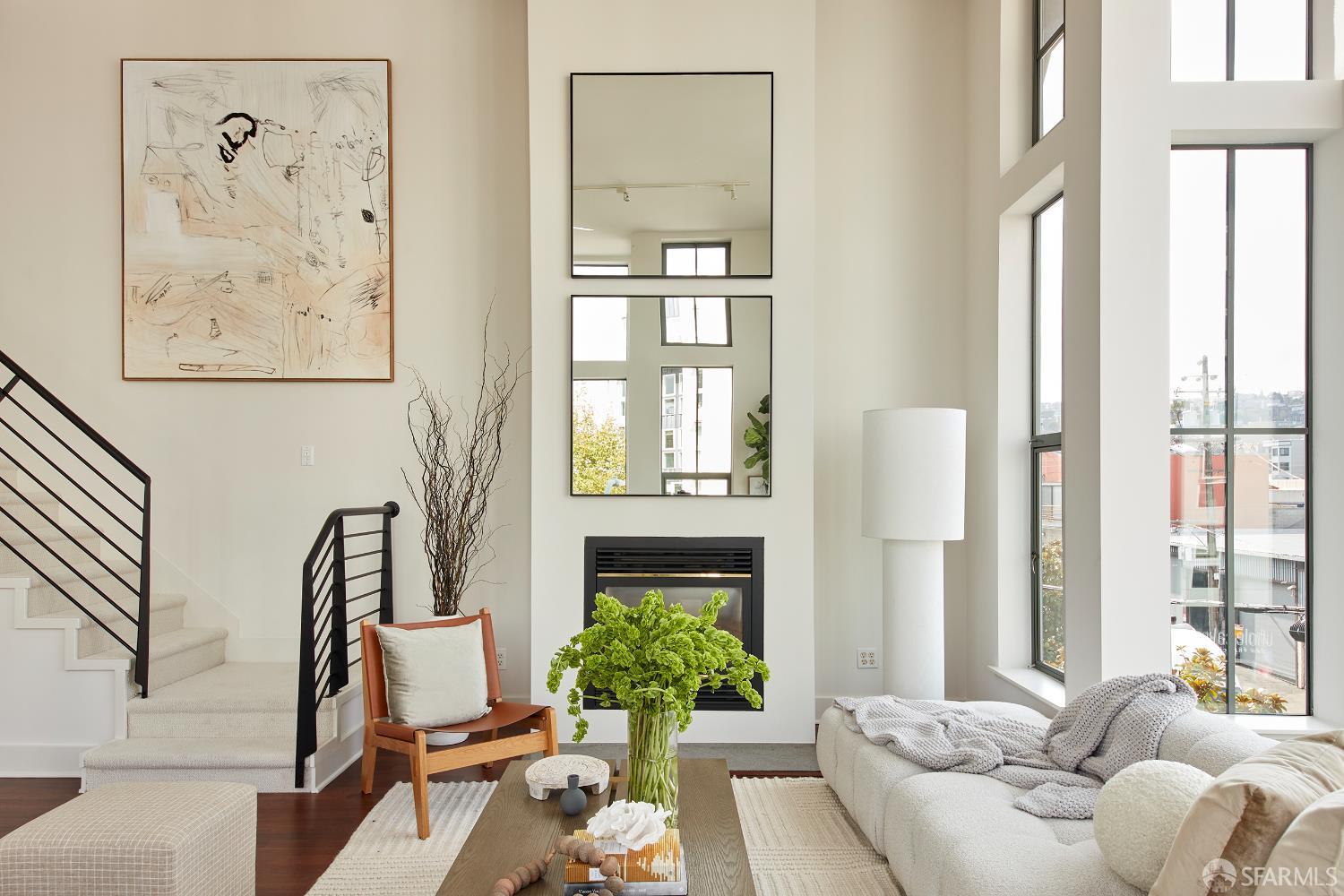 999 16th Street, Unit 11 San Francisco, CA 94107 - Photo 3 of 15 a living room with furniture and a large window