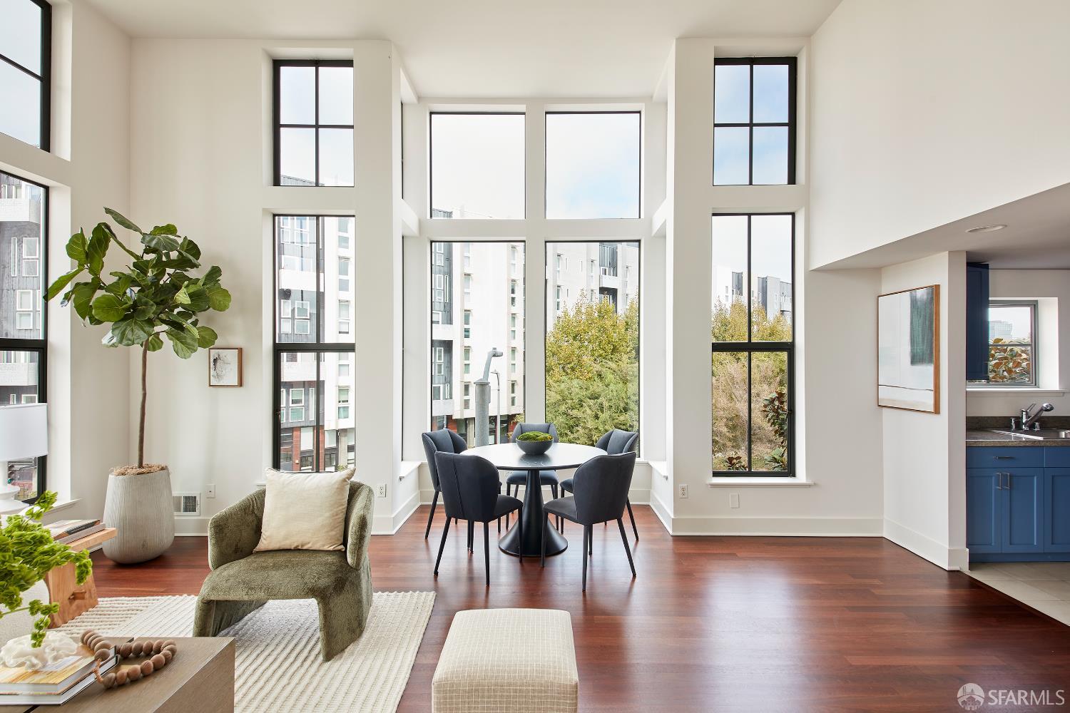 999 16th Street, Unit 11 San Francisco, CA 94107 - Photo 4 of 15 a living room with furniture and a large window