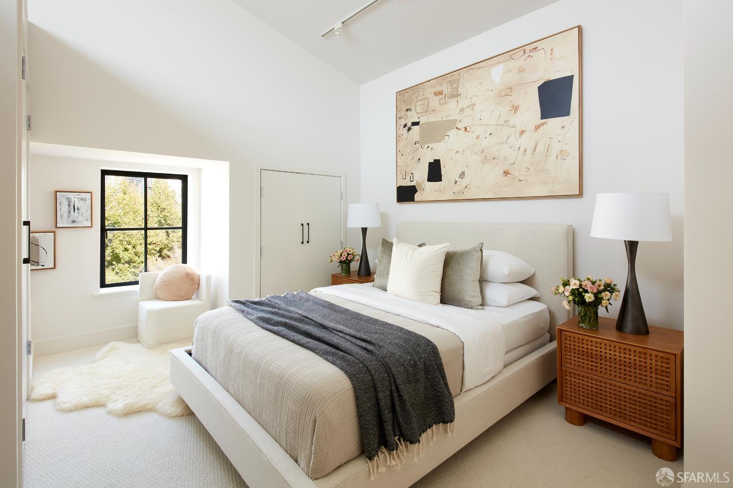 999 16th Street, Unit 11 San Francisco, CA 94107 - Photo 9 of 15 a bedroom with a bed and painting on the wall