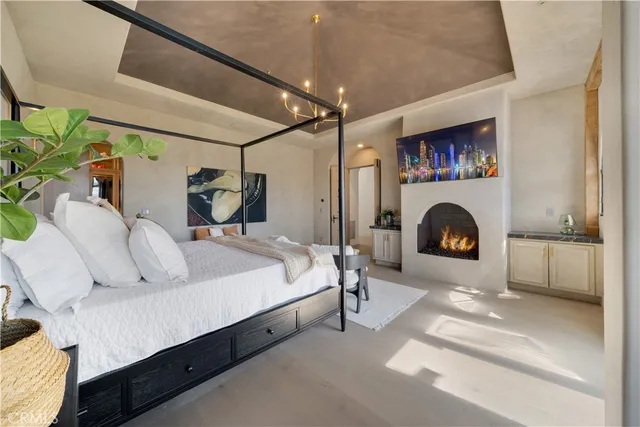 a spacious bedroom with a bed and a couch