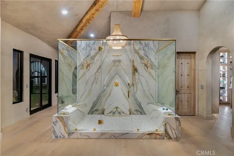 a bathroom with a shower sink and mirror