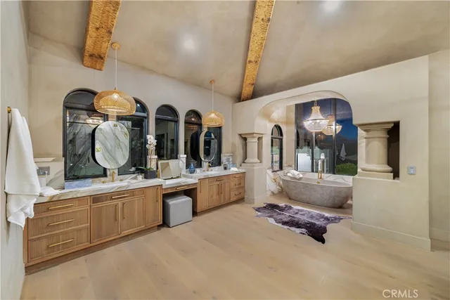 a vase of flowers sitting on a table with window