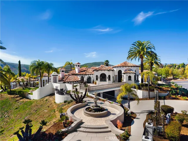 a vase of flowers sitting on a table in front of a window