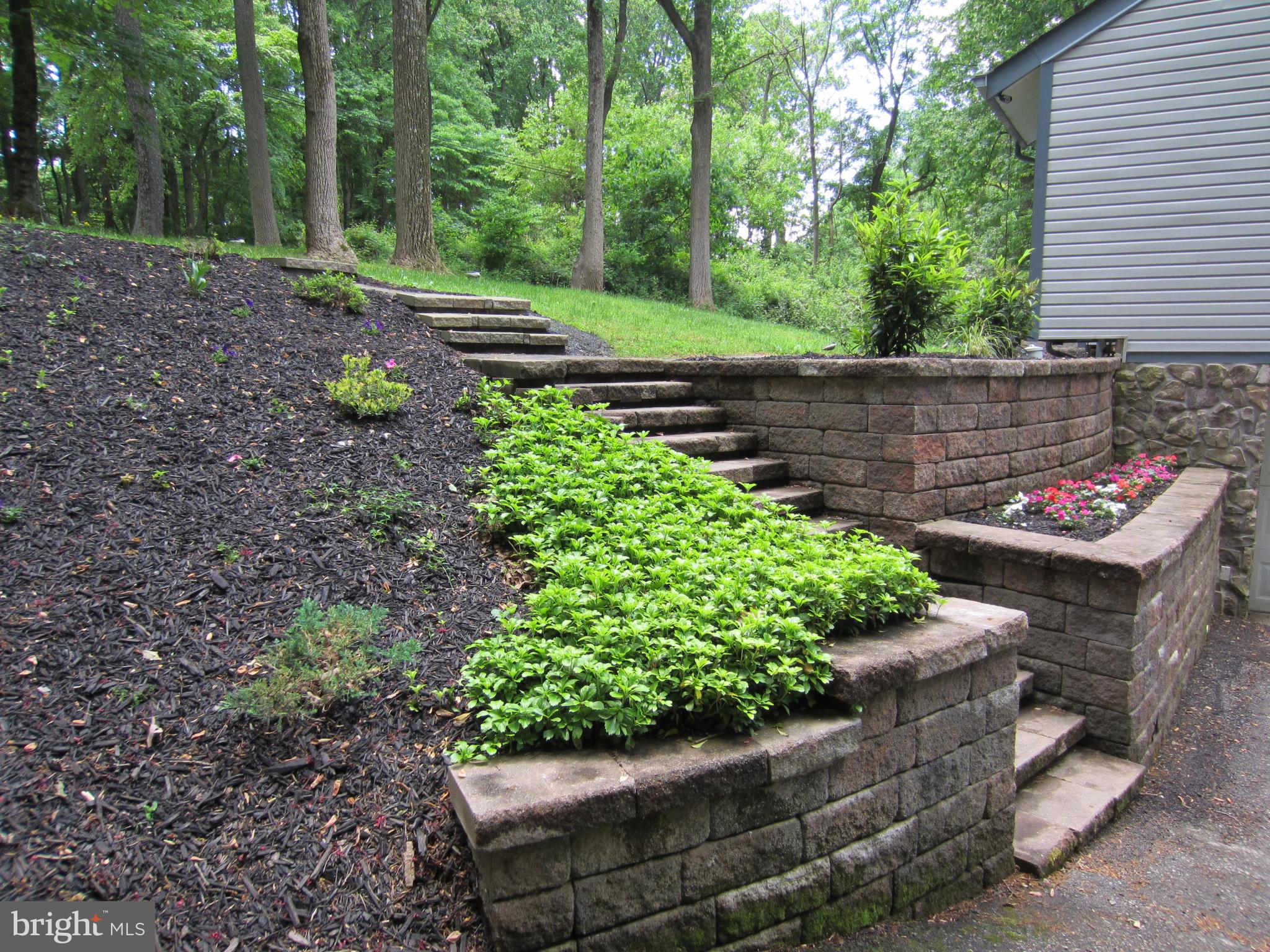 839 Brandywine Road Downingtown, PA 19335 - Photo 29 of 32 Stone walls and steps showcase easy care gardens.
