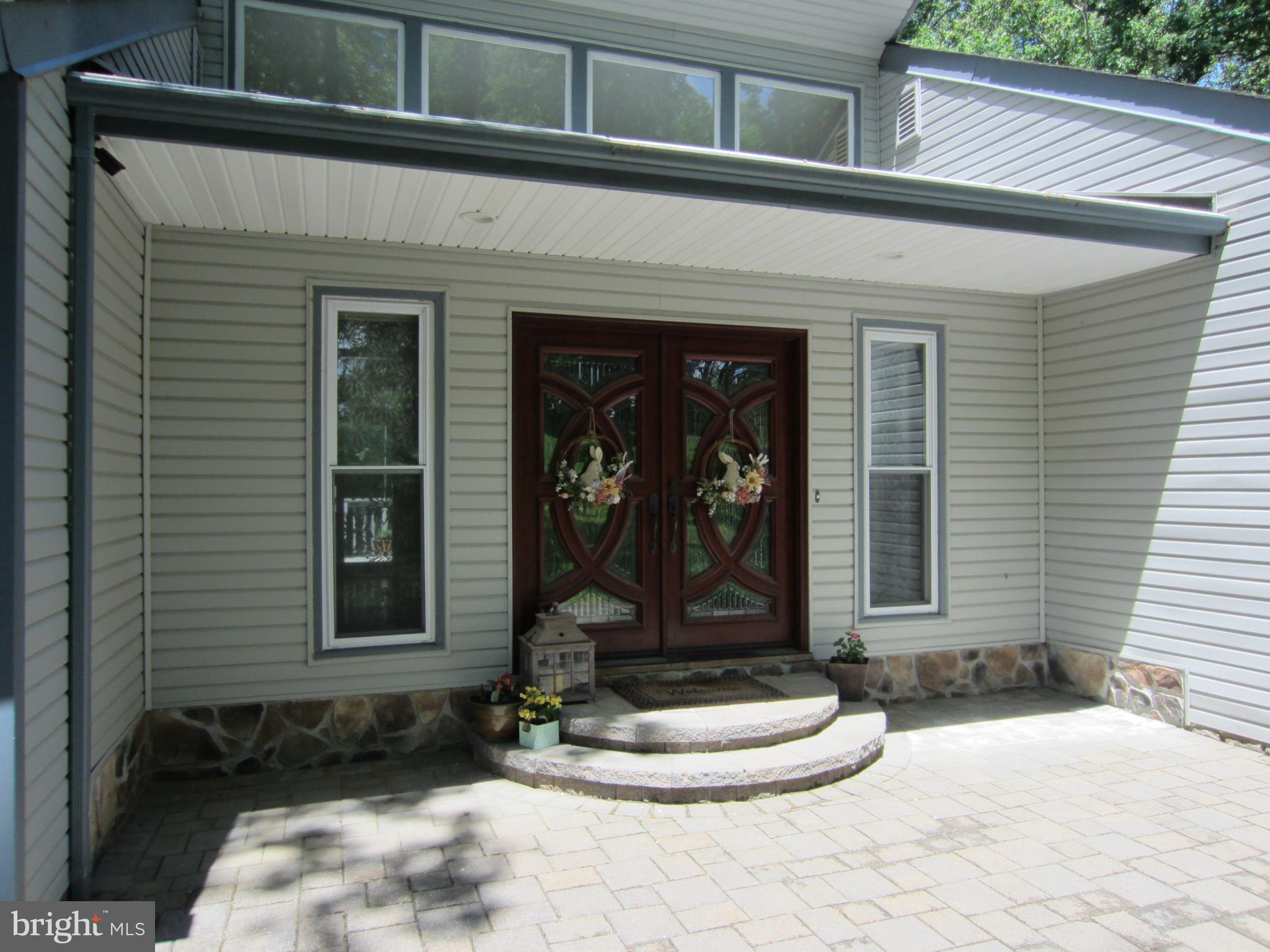 839 Brandywine Road Downingtown, PA 19335 - Photo 4 of 32 Elegant custom front entrance from stone patio.