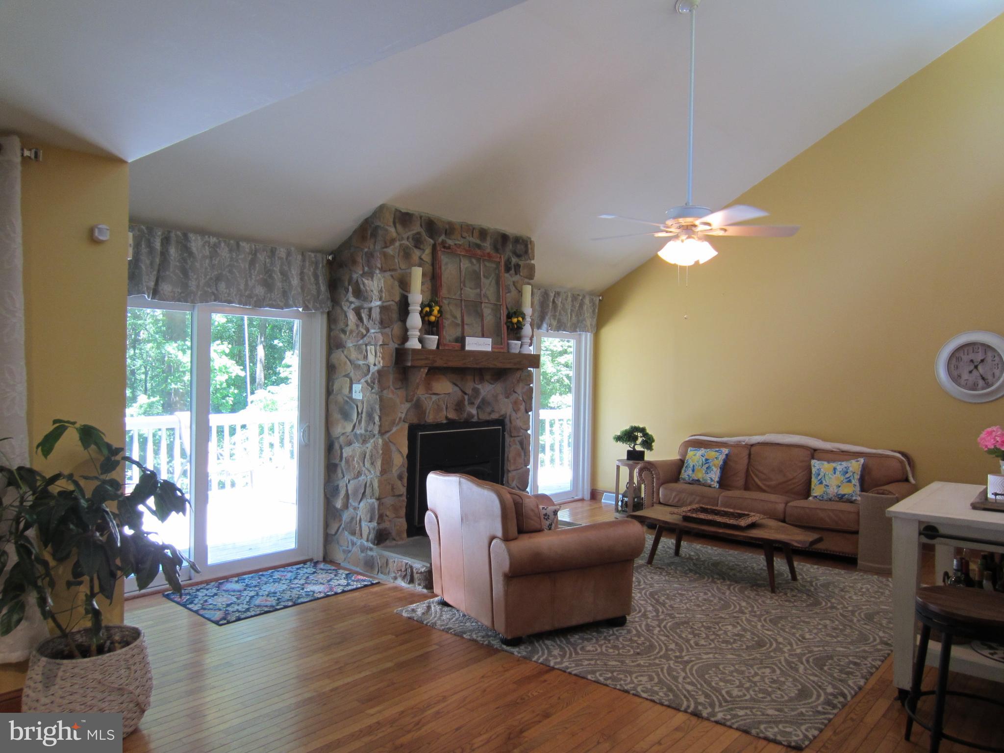 839 Brandywine Road Downingtown, PA 19335 - Photo 9 of 32 Stone fireplace graces Living Rm w deck access