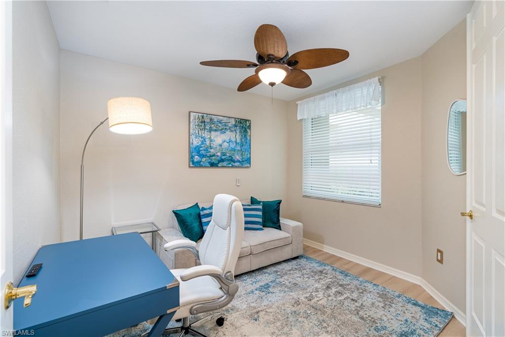 4680 Hawks Nest Way, Unit D103 Naples, FL 34114 - Photo 16 of 41 a living room with furniture and a window