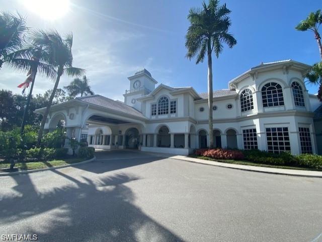 4680 Hawks Nest Way, Unit D103 Naples, FL 34114 - Photo 24 of 41 a front view of multiple houses with yard
