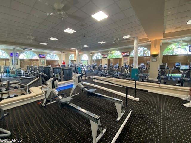 4680 Hawks Nest Way, Unit D103 Naples, FL 34114 - Photo 32 of 41 a room with lots of gym equipment