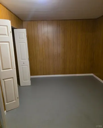 a view of a room with a sink and a mirror
