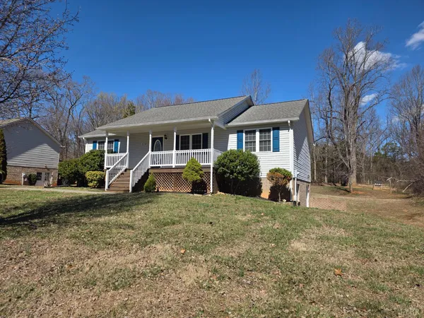 a view of a house with a yard and plants