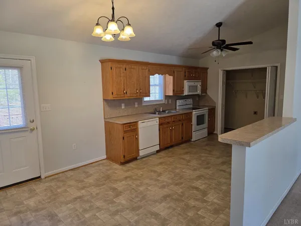 a kitchen with stainless steel appliances granite countertop a stove and a sink
