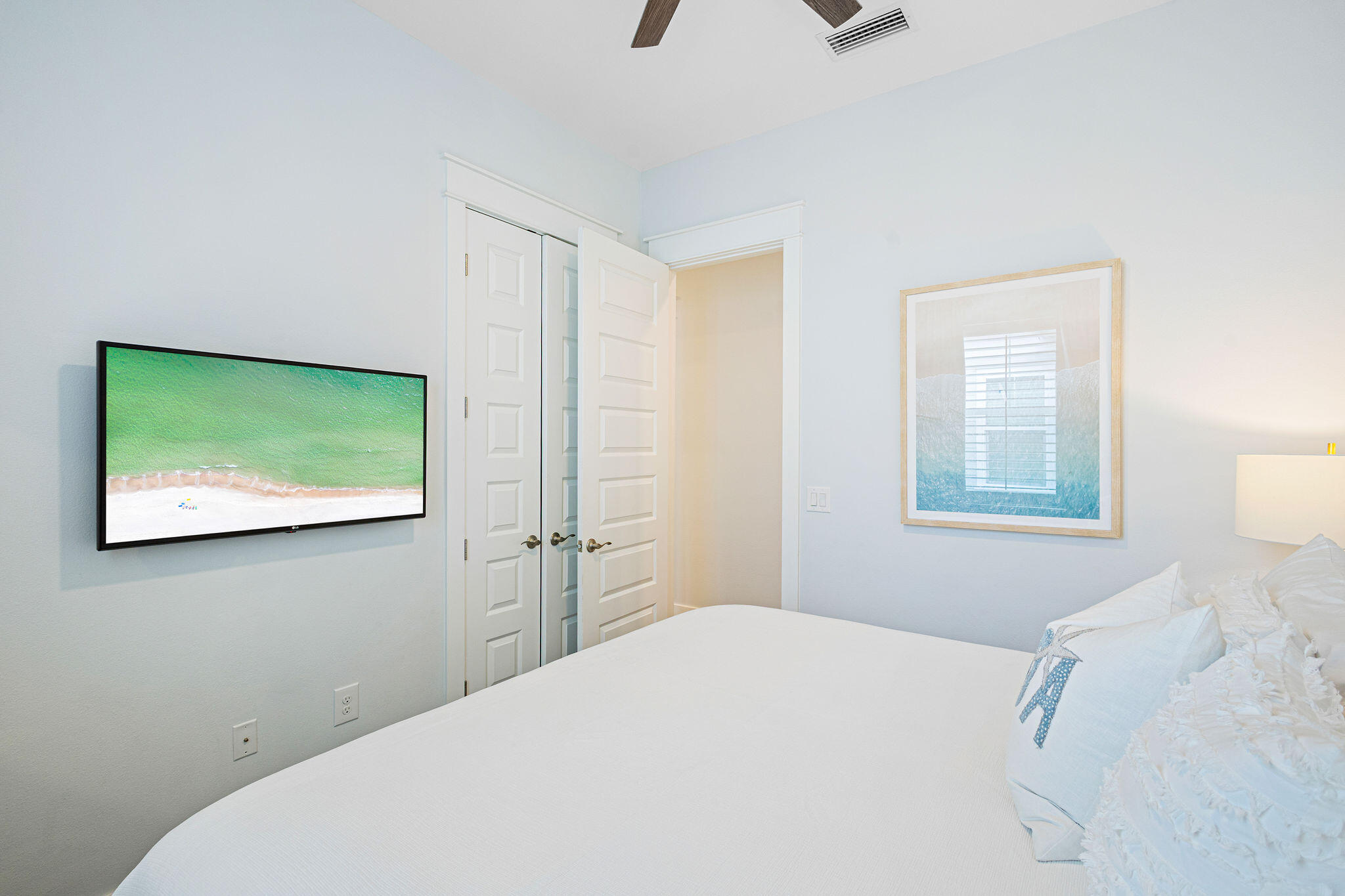 209 Milestone Dr Inlet Beach, Unit A Inlet Beach, FL 32461 - Photo 23 of 65 a bedroom with a bed and painting on the wall