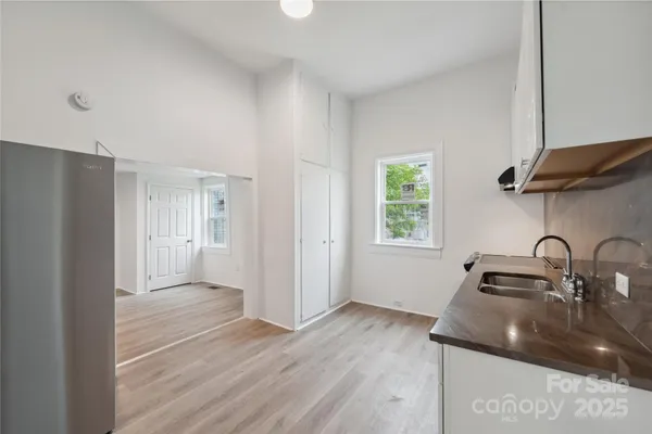 a kitchen with a sink and a window