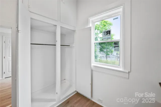 a view of front door with wooden floor