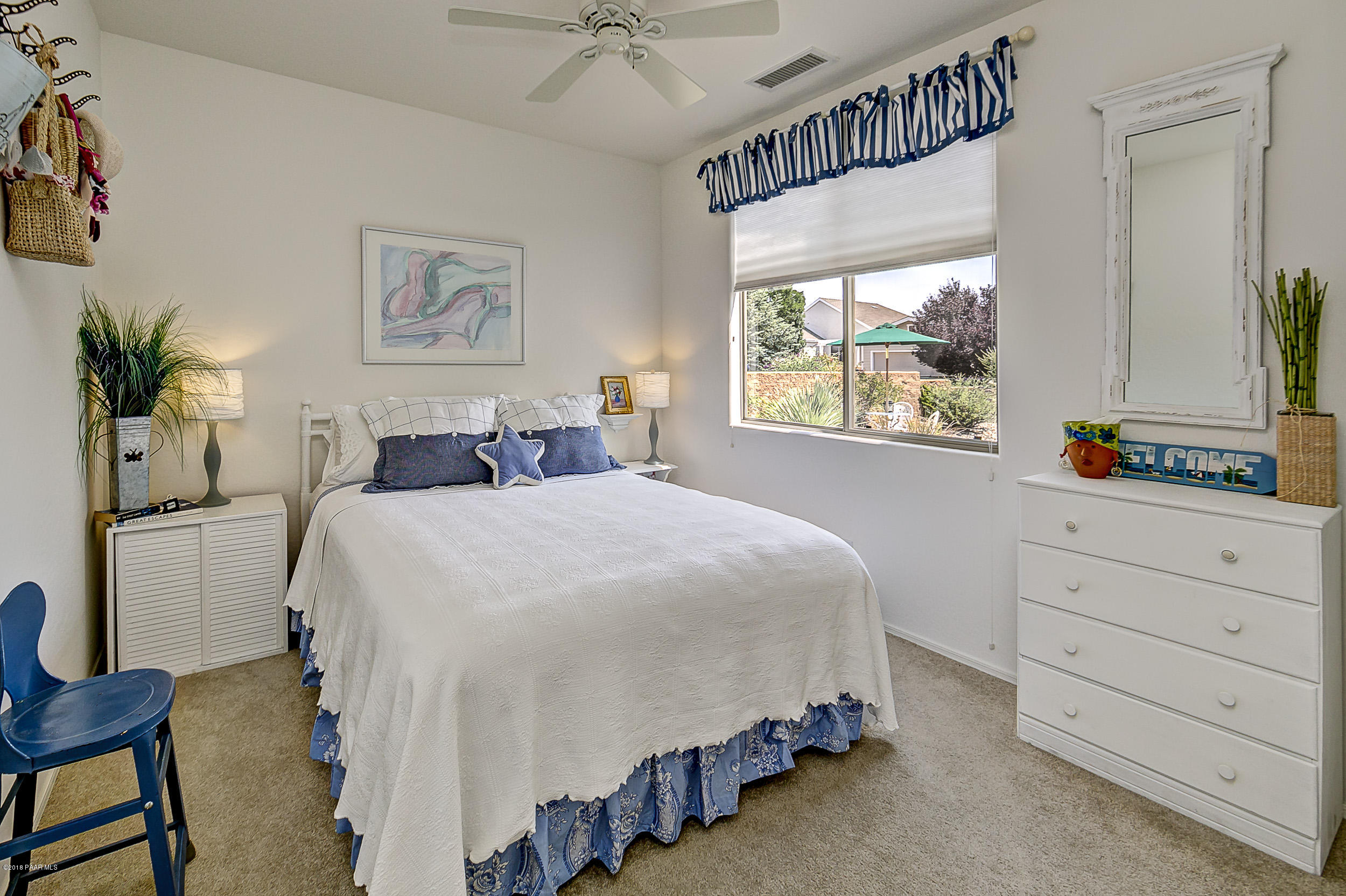 7106 Lynx Wagon Road Prescott Valley, AZ 86314 - Photo 11 of 26 a bedroom with a large bed and a window