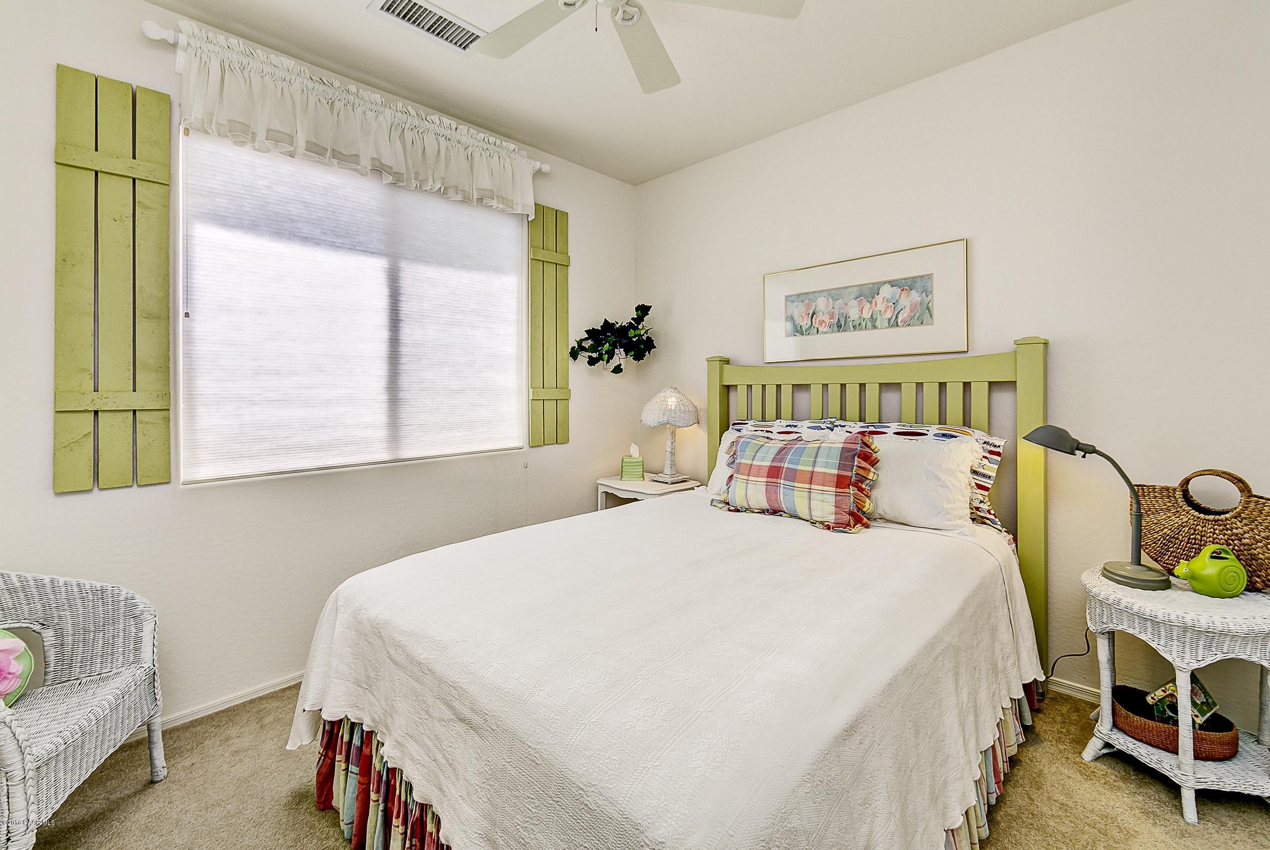 7106 Lynx Wagon Road Prescott Valley, AZ 86314 - Photo 13 of 26 a bedroom with a bed and a table