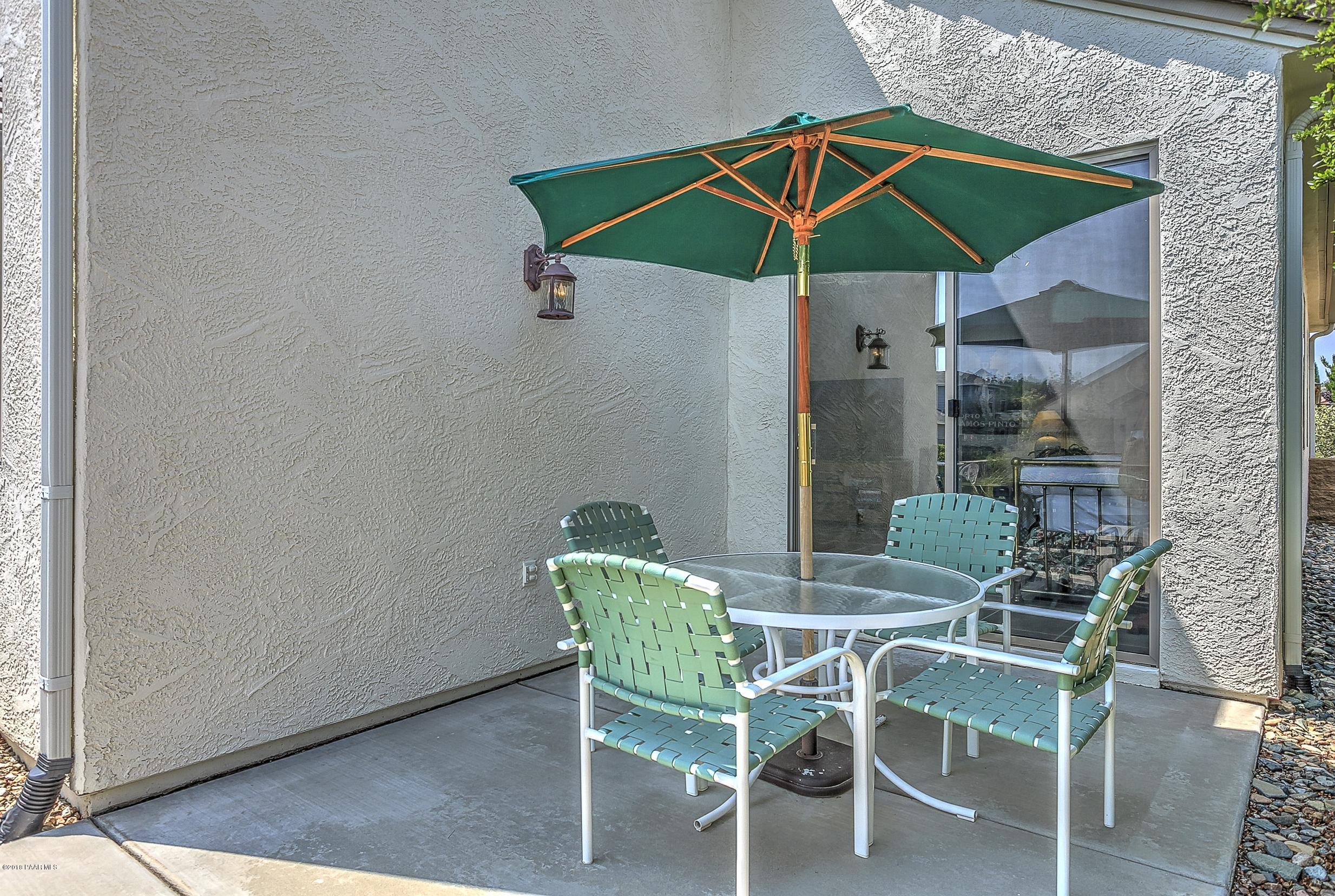 7106 Lynx Wagon Road Prescott Valley, AZ 86314 - Photo 15 of 26 a view of a dining room with furniture and chandelier