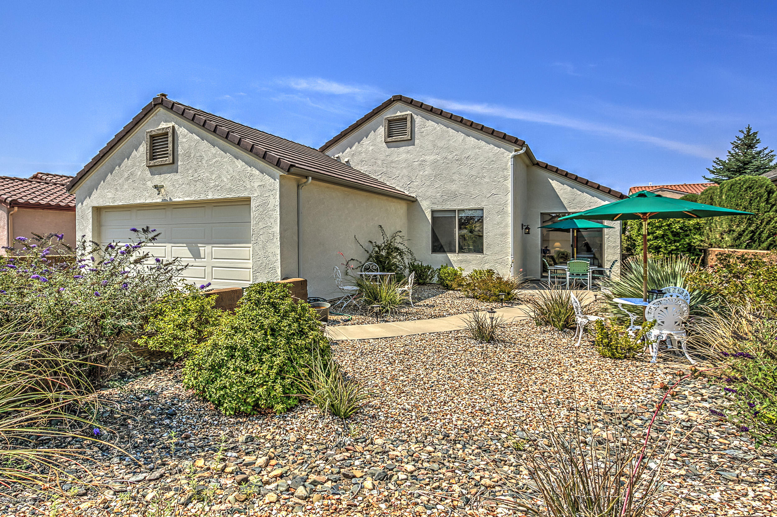 7106 Lynx Wagon Road Prescott Valley, AZ 86314 - Photo 17 of 26 a front view of a house with a small yard