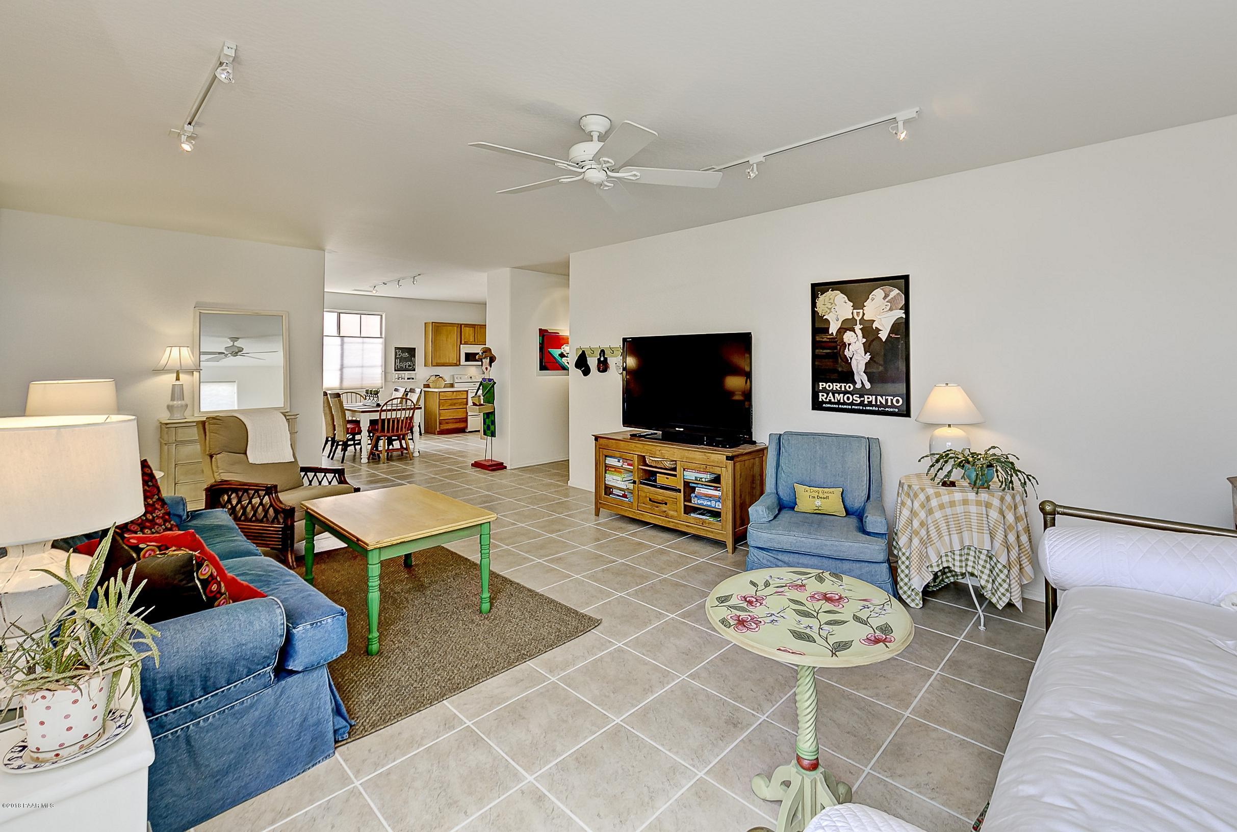 7106 Lynx Wagon Road Prescott Valley, AZ 86314 - Photo 5 of 26 a living room with furniture and a flat screen tv