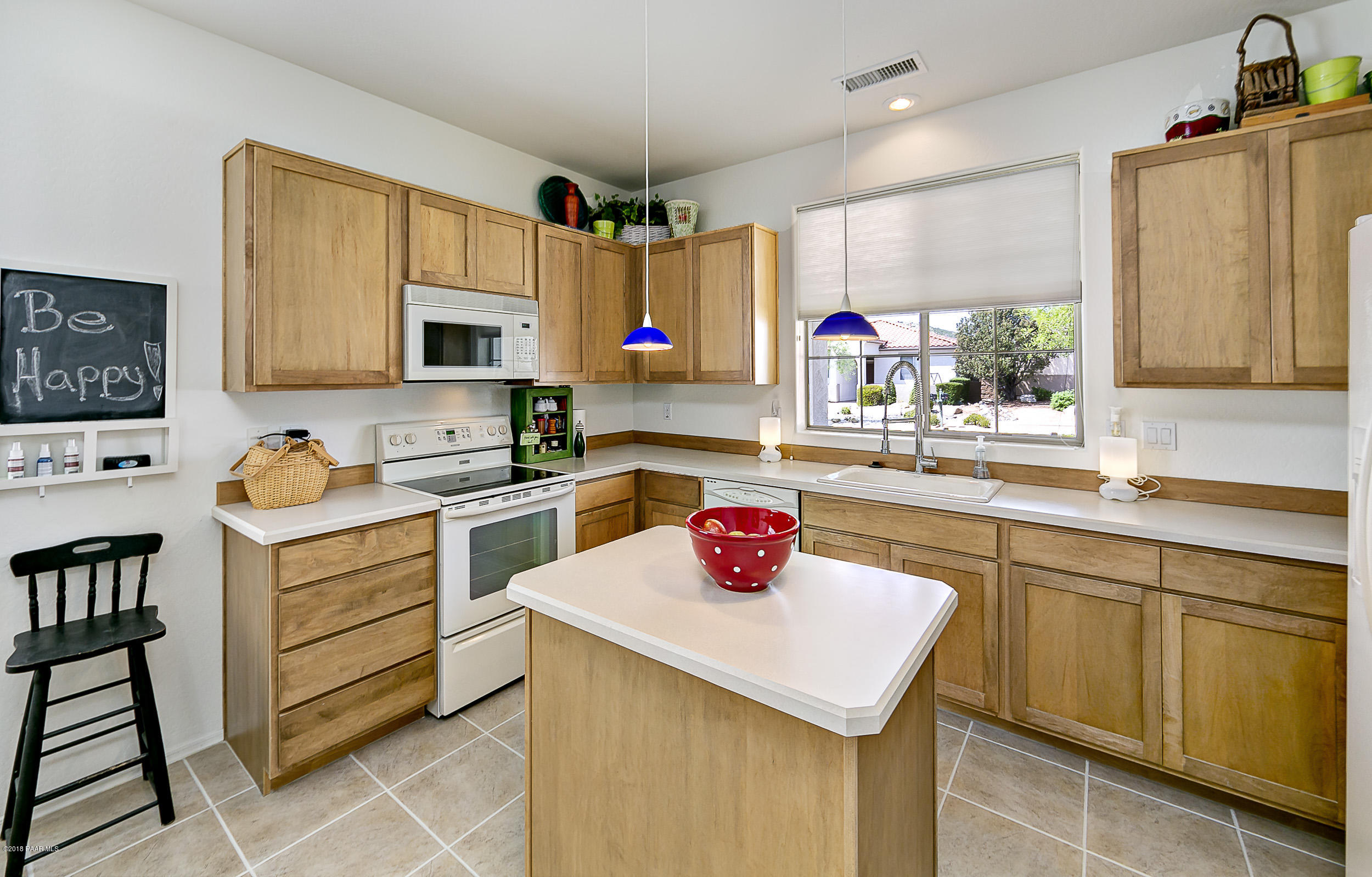 7106 Lynx Wagon Road Prescott Valley, AZ 86314 - Photo 6 of 26 a kitchen with a sink cabinets and window