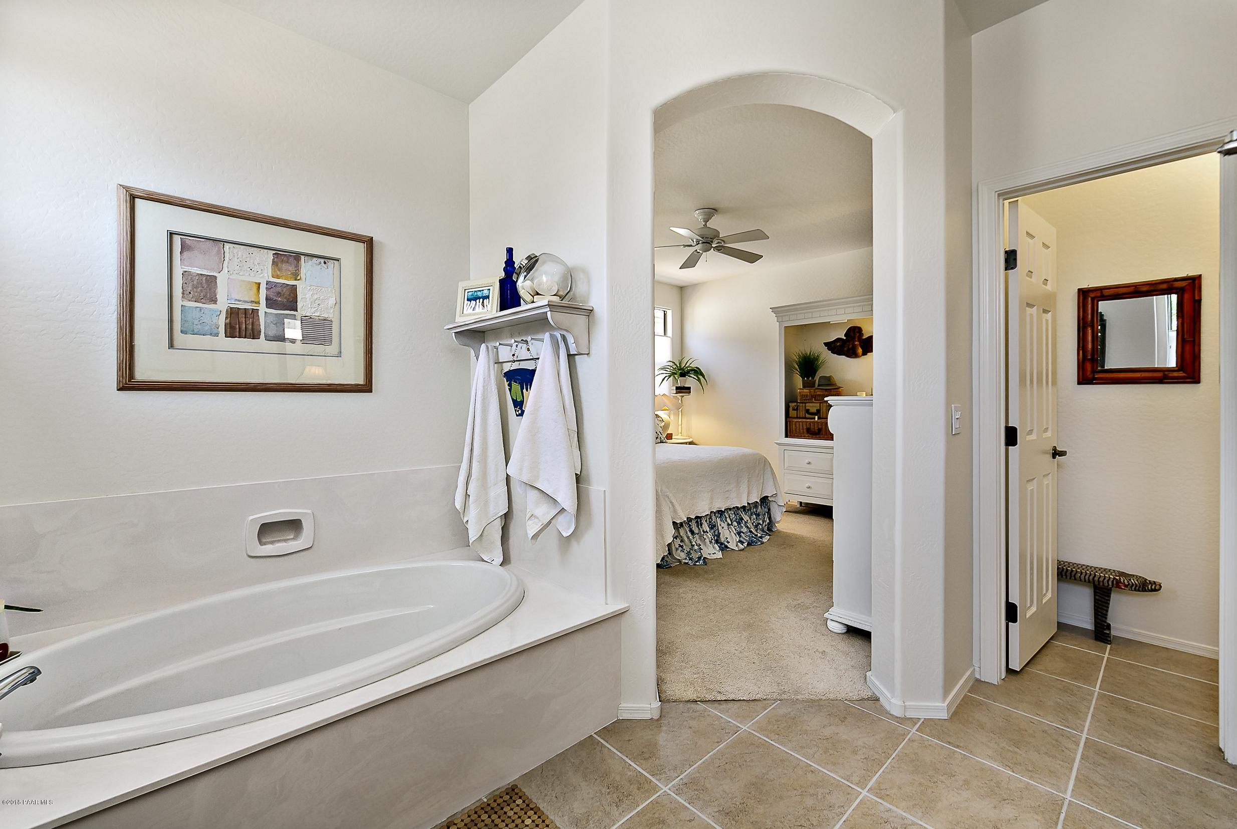 7106 Lynx Wagon Road Prescott Valley, AZ 86314 - Photo 10 of 26 a bathroom with a tub and a shower
