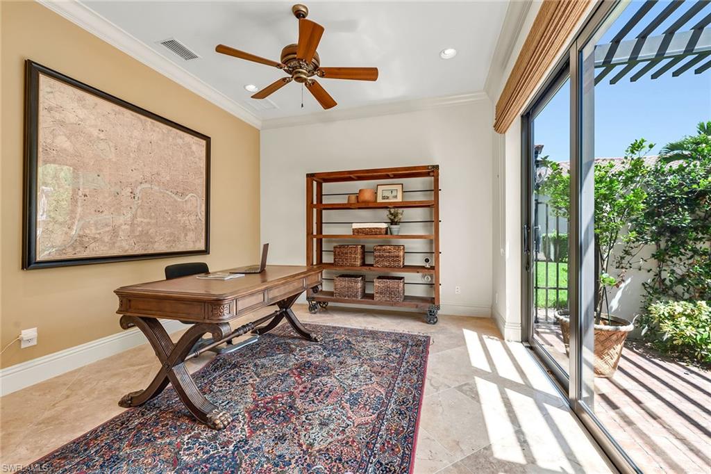 16839 Cabreo Drive Naples, FL 34110 - Photo 16 of 23 a living room with furniture and a large window