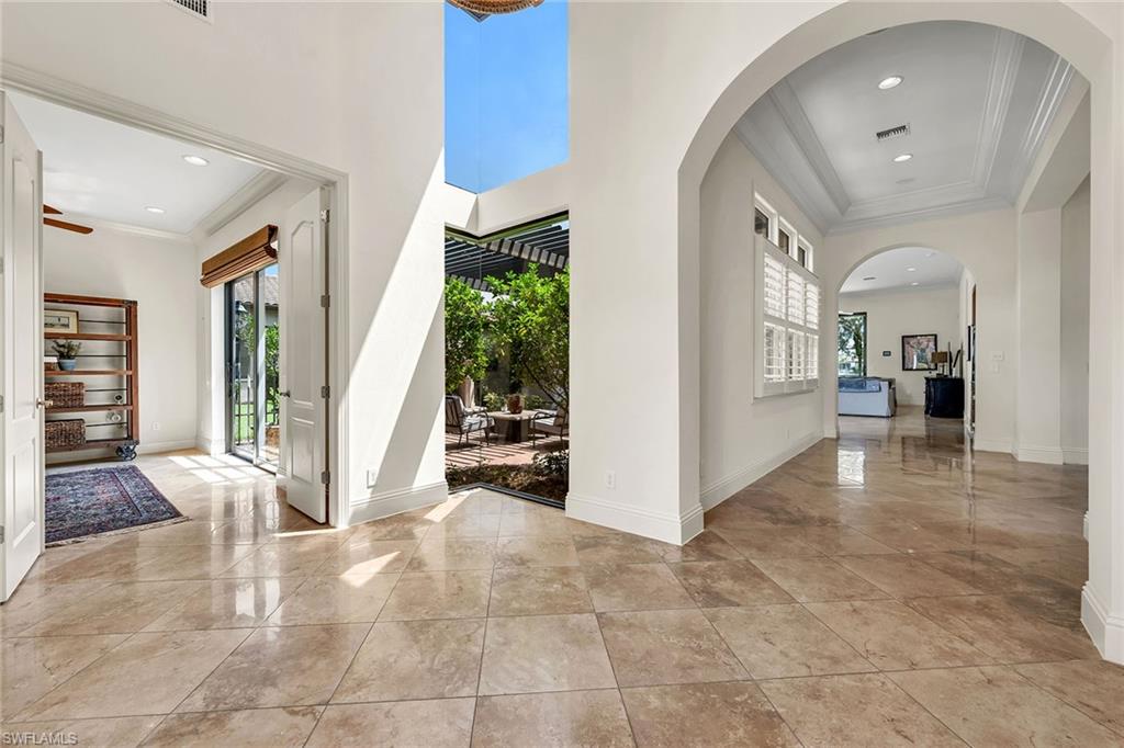 16839 Cabreo Drive Naples, FL 34110 - Photo 17 of 23 a view of livingroom with furniture and floor to ceiling window