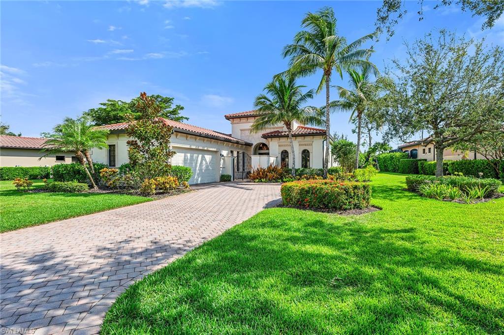 16839 Cabreo Drive Naples, FL 34110 - Photo 23 of 23 a front view of a house with a yard