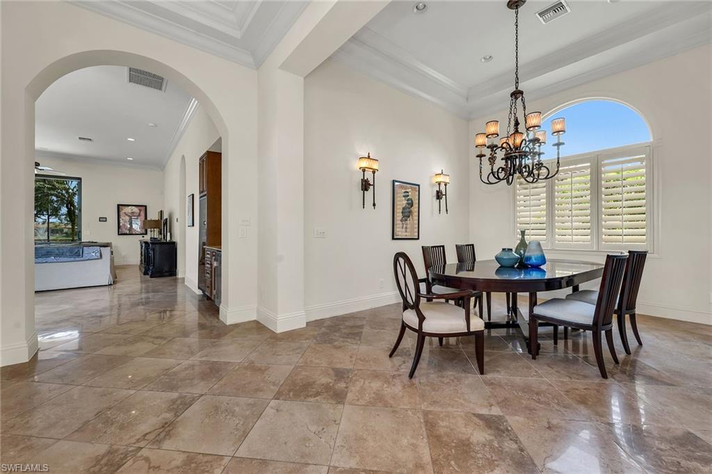 16839 Cabreo Drive Naples, FL 34110 - Photo 9 of 23 a dining room with furniture and window
