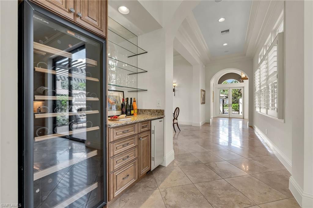 16839 Cabreo Drive Naples, FL 34110 - Photo 10 of 23 a view of kitchen with cabinets and outdoor view