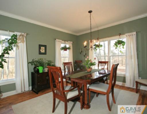 1100 Tullo Road Bridgewater, NJ 08836 - Photo 3 of 10 a dining room with furniture window and wooden floor