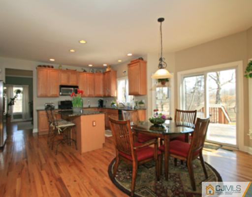 1100 Tullo Road Bridgewater, NJ 08836 - Photo 4 of 10 a dining room with furniture window wooden floor