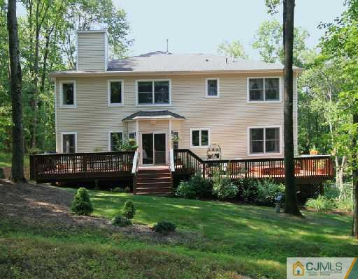 1100 Tullo Road Bridgewater, NJ 08836 - Photo 10 of 10 a front view of a house with a yard table and chairs