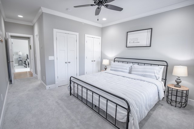 379 Beechcroft Road Spring Hill, TN 37174 - Photo 17 of 18 a bedroom with a large bed and a chandelier