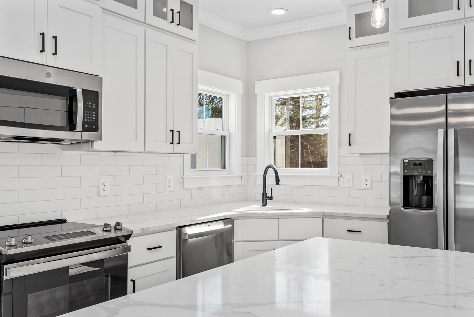 379 Beechcroft Road Spring Hill, TN 37174 - Photo 6 of 18 a kitchen with stainless steel appliances granite countertop a refrigerator sink and stove