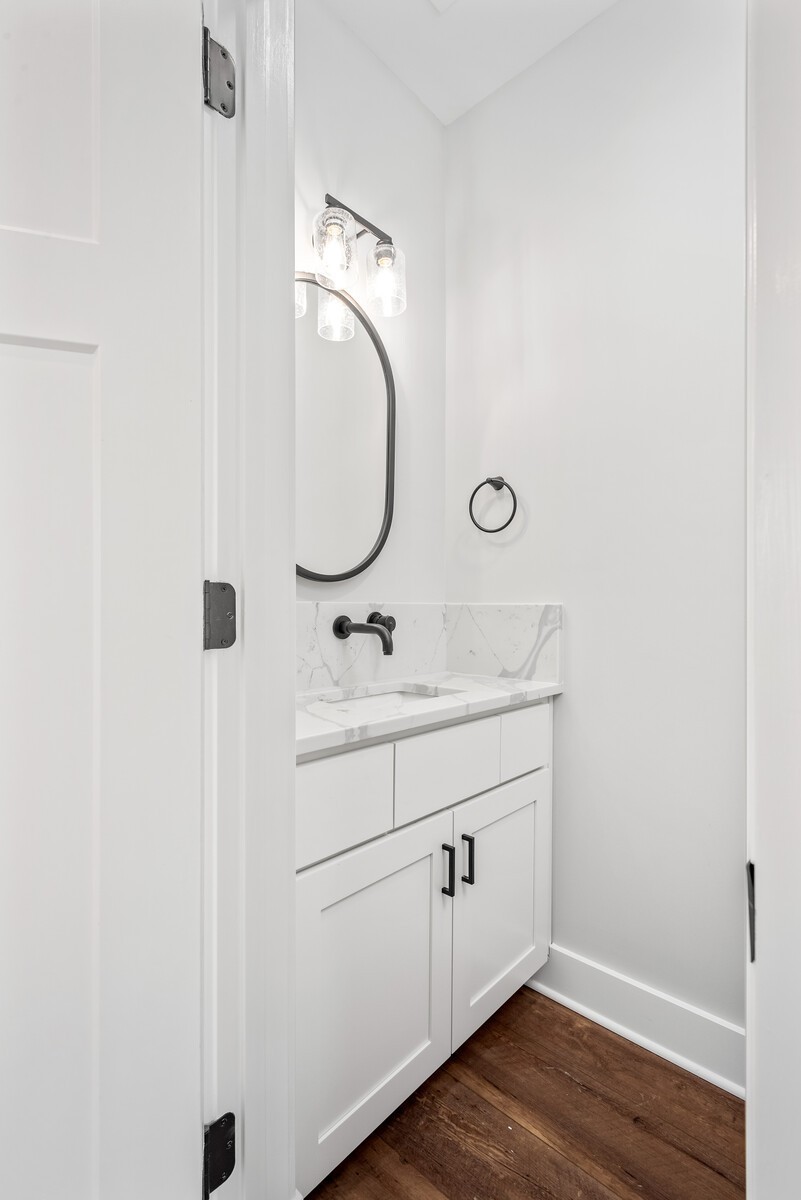 379 Beechcroft Road Spring Hill, TN 37174 - Photo 8 of 18 a bathroom with a sink and mirror