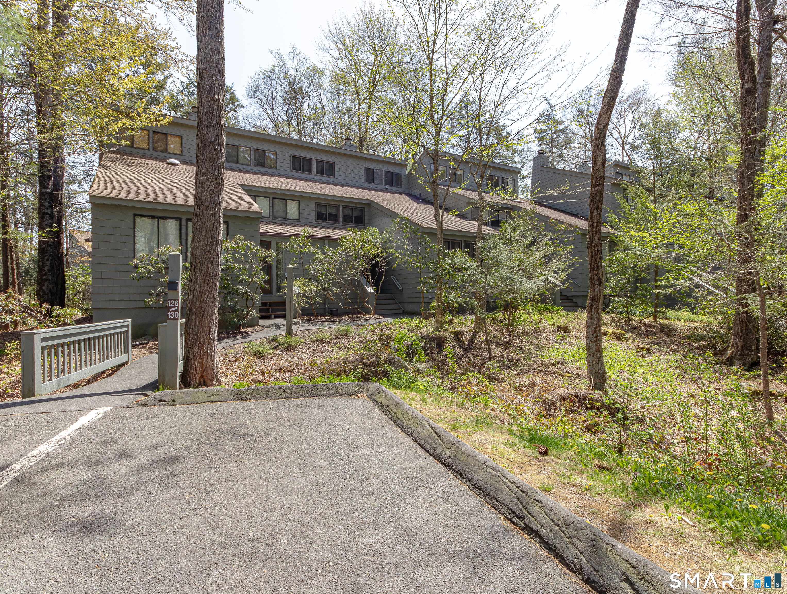 127 Old Farms Road, Unit 127 Torrington, CT 06790 - Photo 1 of 32 a view of a house with backyard and trees